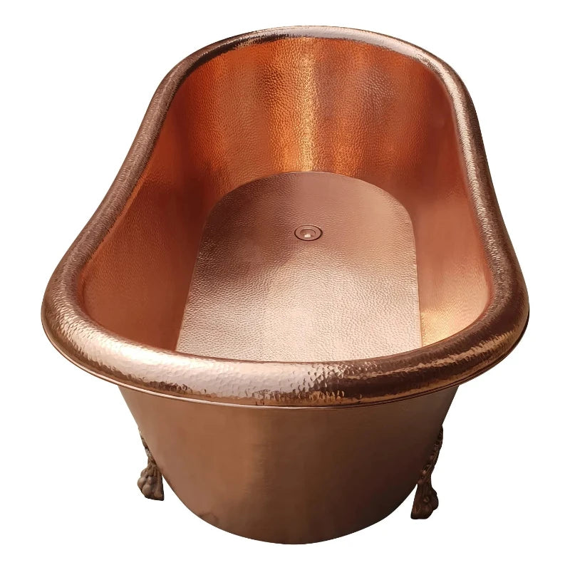 Coppersmith Creations Clawfoot Copper Tub featuring a hammered finish with a single slipper design. The elegant tub rests on classic clawfoot legs, providing a luxurious touch to any bathroom. Side view. 