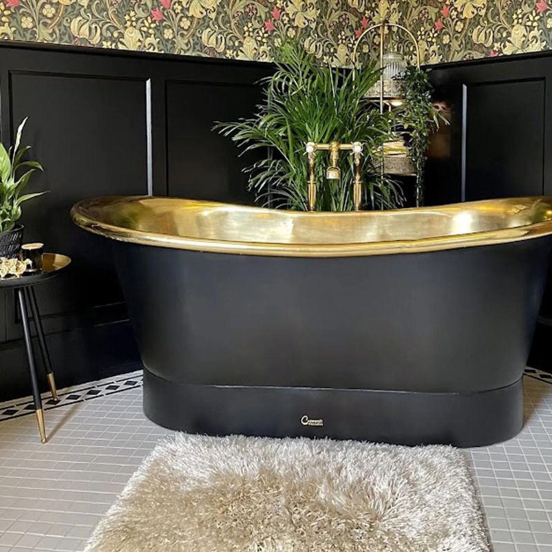 Coppersmith Creations Straight Base Brass Bathtub Black Outside 1700mm front view with green plants