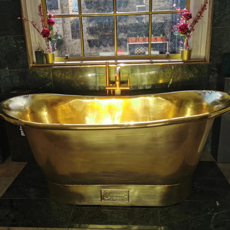 Coppersmith Creations Straight Base Brass Bathtub Full Polished Brass Finish 1700mm front view next to window