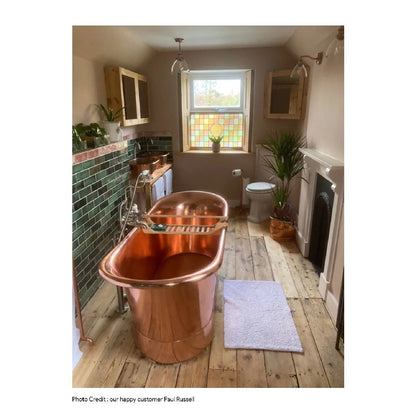 Coppersmith Creations Straight Base Copper Bathtub Full Polish Copper Finish 1700mm in rustic bathroom with fireplace next to window